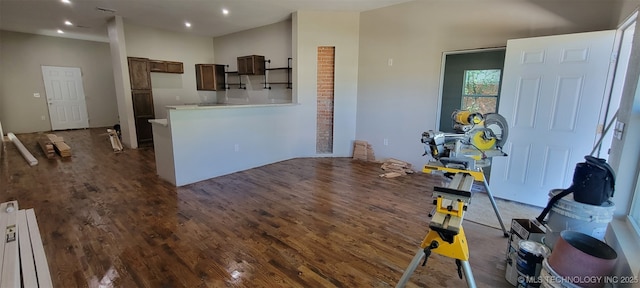 510 S Madison Ave, Wagoner, OK 74467 - kitchen featuring dark wood-type flooring, a peninsula, light countertops, recessed lighting, and radiator