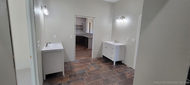 510 S Madison Ave, Wagoner, OK 74467 - full bath with two vanities and stone finish flooring