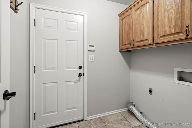 11604 E 99th St, Owasso, OK 74055 - laundry room featuring cabinet space, hookup for an electric dryer, baseboards, hookup for a washing machine, and light tile patterned floors