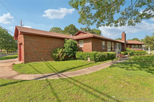 1401 E S Ave, Mcalester, OK 74501 - view of front of property with a chimney, brick siding, a garage, and a front yard