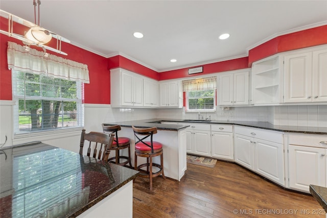 1401 E S Ave, Mcalester, OK 74501 - kitchen featuring white cabinetry, open shelves, dark wood finished floors, a sink, and crown molding