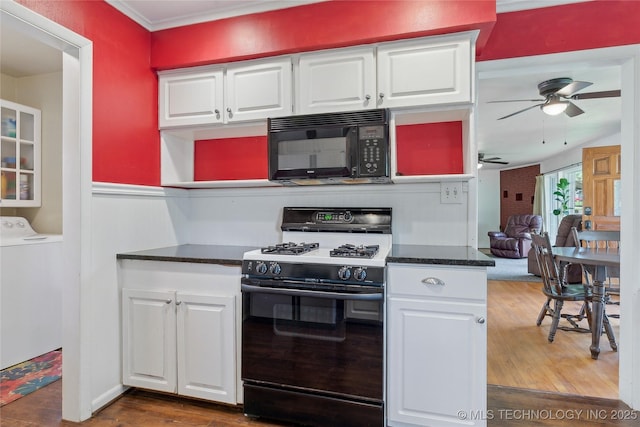 1401 E S Ave, Mcalester, OK 74501 - kitchen featuring black microwave, gas stove, washer / clothes dryer, ceiling fan, and white cabinets