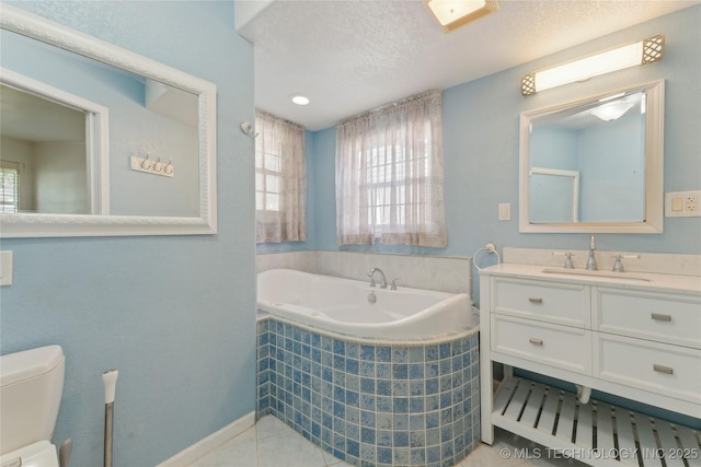 1401 E S Ave, Mcalester, OK 74501 - bathroom with healthy amount of natural light, a garden tub, toilet, vanity, and a textured ceiling