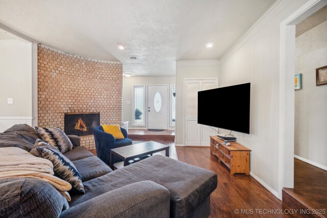 5212 S 68th E Pl, Tulsa, OK 74145 - living area with wood finished floors, a brick fireplace, ornamental molding, and baseboards