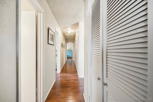 5212 S 68th E Pl, Tulsa, OK 74145 - corridor featuring dark wood-style flooring and baseboards