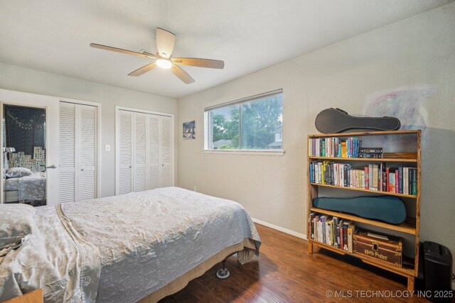 5212 S 68th E Pl, Tulsa, OK 74145 - bedroom featuring wood finished floors, baseboards, two closets, and a ceiling fan