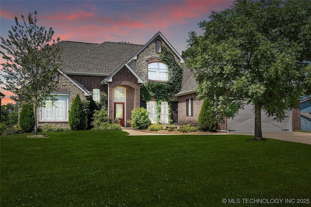 465 E 113th St S, Jenks, OK 74037 - french country style house featuring brick siding, a lawn, driveway, and a shingled roof
