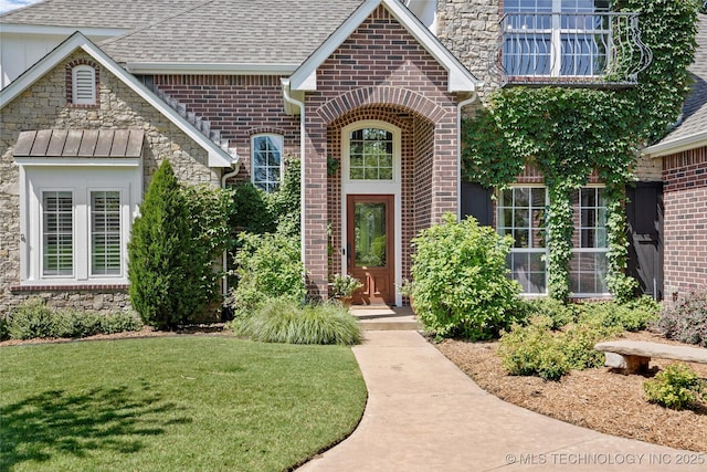 465 E 113th St S, Jenks, OK 74037 - property entrance featuring roof with shingles, brick siding, and a yard