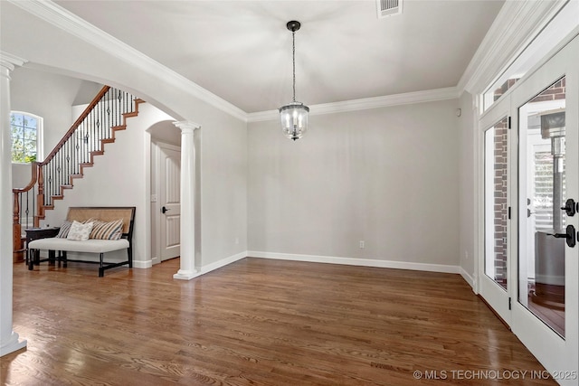 465 E 113th St S, Jenks, OK 74037 - unfurnished dining area featuring dark wood-style flooring, ornate columns, arched walkways, crown molding, and baseboards