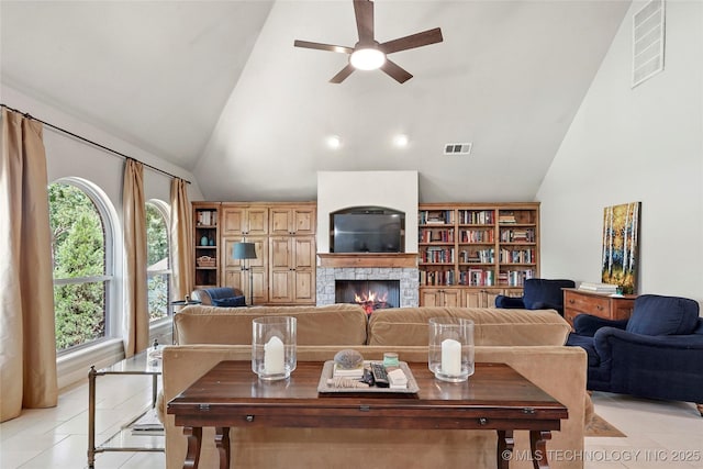 465 E 113th St S, Jenks, OK 74037 - living area featuring ceiling fan, light tile patterned floors, high vaulted ceiling, and a stone fireplace
