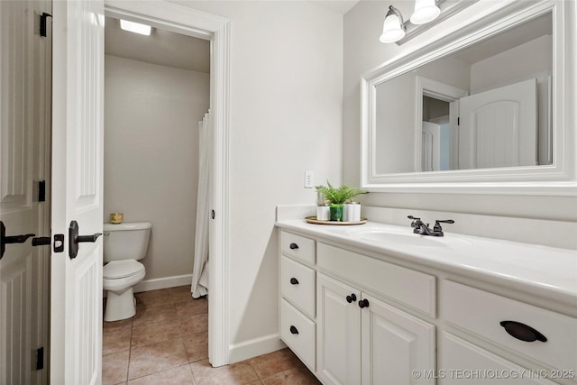 465 E 113th St S, Jenks, OK 74037 - bathroom featuring vanity, toilet, baseboards, and tile patterned flooring