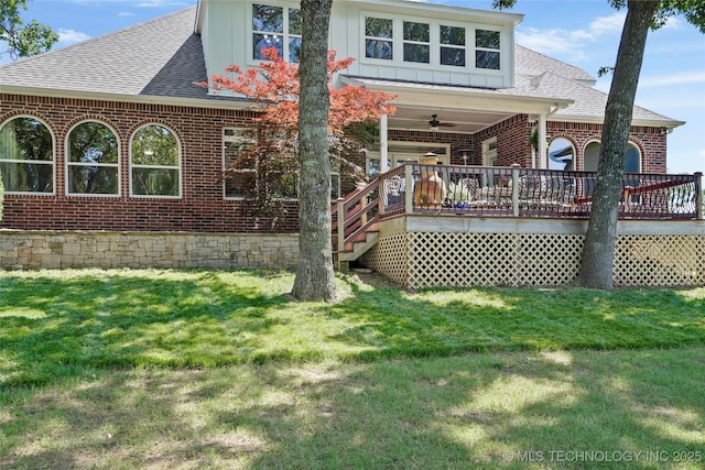 465 E 113th St S, Jenks, OK 74037 - back of house featuring brick siding, roof with shingles, a ceiling fan, a yard, and board and batten siding