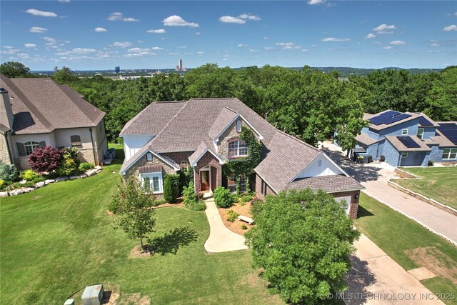 465 E 113th St S, Jenks, OK 74037 - view of front of home with brick siding, stone siding, and a front yard