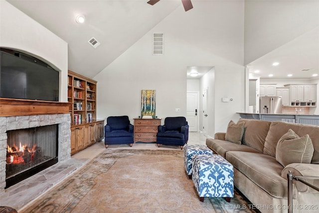 465 E 113th St S, Jenks, OK 74037 - living room featuring high vaulted ceiling, a ceiling fan, a stone fireplace, and recessed lighting