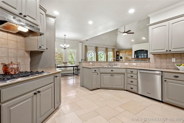 465 E 113th St S, Jenks, OK 74037 - kitchen with stainless steel appliances, under cabinet range hood, a sink, tasteful backsplash, and ceiling fan