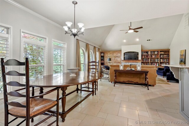 465 E 113th St S, Jenks, OK 74037 - dining area with lofted ceiling, a ceiling fan, built in shelves, ornamental molding, and a chandelier