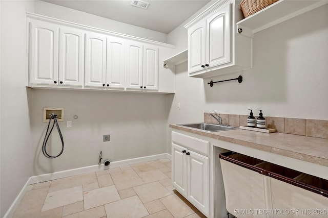 465 E 113th St S, Jenks, OK 74037 - washroom featuring hookup for a gas dryer, cabinet space, washer hookup, baseboards, and electric dryer hookup
