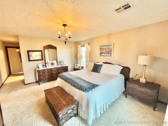 2102 N Peaceful Ln, Stigler, OK 74462 - bedroom featuring light carpet, a chandelier, baseboards, and a textured ceiling