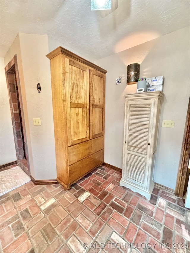 2102 N Peaceful Ln, Stigler, OK 74462 - bathroom with brick floors and baseboards