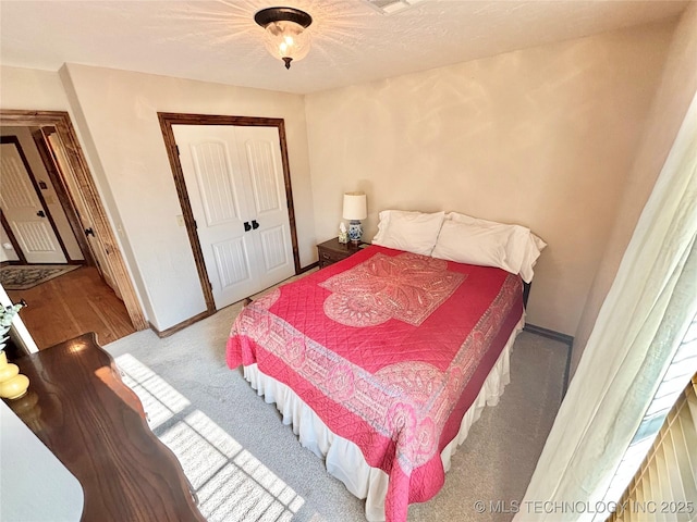 2102 N Peaceful Ln, Stigler, OK 74462 - carpeted bedroom featuring baseboards and a closet