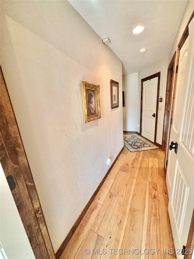 2102 N Peaceful Ln, Stigler, OK 74462 - corridor featuring light wood-type flooring, baseboards, and recessed lighting