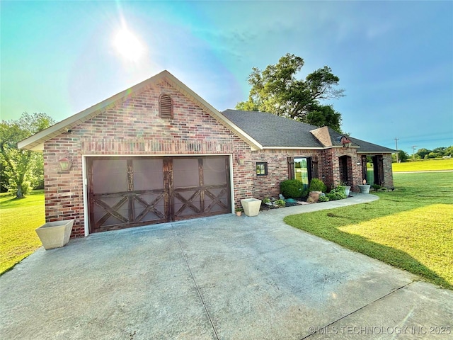 2102 N Peaceful Ln, Stigler, OK 74462 - view of front of home with brick siding, a front yard, concrete driveway, an attached garage, and a shingled roof