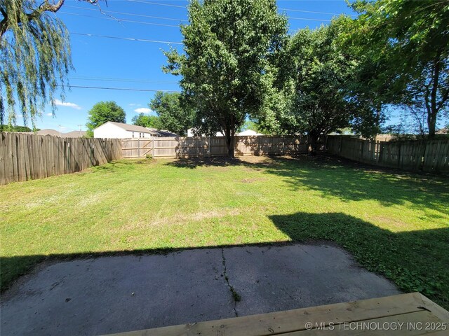 1100 Guinn Ln, Bartlesville, OK 74006 - view of yard featuring a patio area