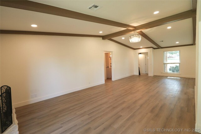 1100 Guinn Ln, Bartlesville, OK 74006 - unfurnished living room featuring recessed lighting, baseboards, and wood finished floors
