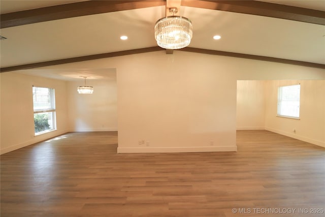 1100 Guinn Ln, Bartlesville, OK 74006 - spare room featuring a chandelier, baseboards, wood finished floors, and recessed lighting