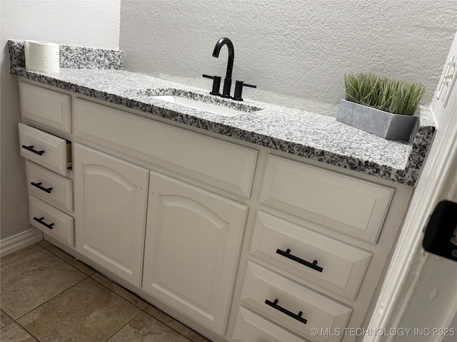 211 E Waco Pl, Broken Arrow, OK 74011 - bathroom with tile patterned flooring and vanity