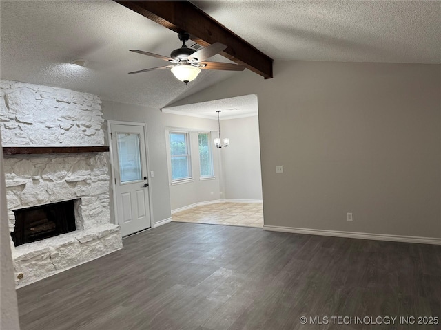 211 E Waco Pl, Broken Arrow, OK 74011 - unfurnished living room with a stone fireplace, a textured ceiling, wood finished floors, ceiling fan, and baseboards