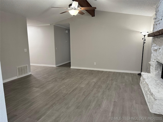 211 E Waco Pl, Broken Arrow, OK 74011 - unfurnished living room featuring a ceiling fan, a fireplace, wood finished floors, vaulted ceiling, and a textured ceiling