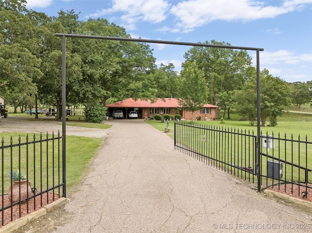 1307 Chickasaw Rd, Calera, OK 74730 - surrounding community featuring driveway, a carport, and view of scattered trees
