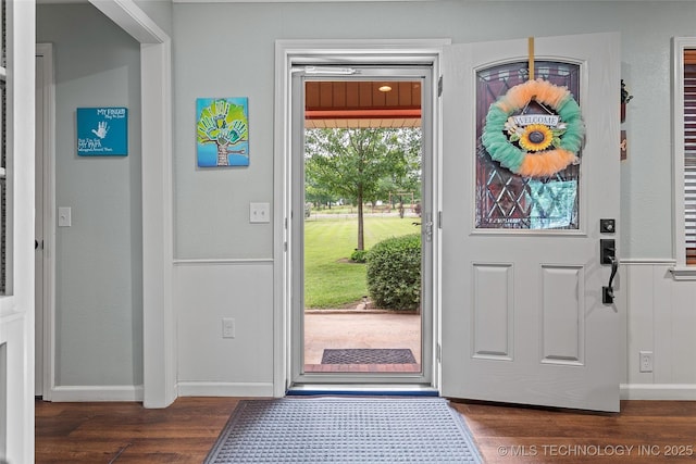 1307 Chickasaw Rd, Calera, OK 74730 - foyer with dark wood finished floors and a wainscoted wall