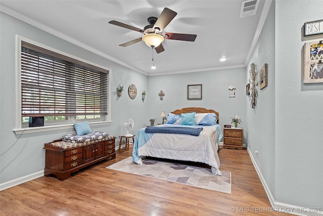 1307 Chickasaw Rd, Calera, OK 74730 - bedroom featuring crown molding, wood finished floors, a textured wall, recessed lighting, and ceiling fan