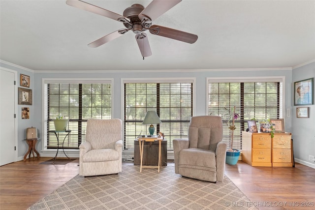 1307 Chickasaw Rd, Calera, OK 74730 - living area with wood finished floors, crown molding, and ceiling fan