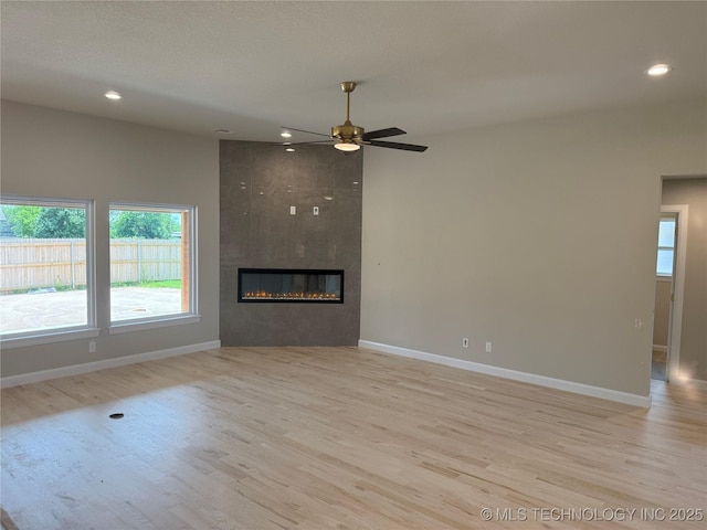 22832 E 106th Pl S, Broken Arrow, OK 74014 - unfurnished living room featuring recessed lighting, light wood-style floors, baseboards, and ceiling fan