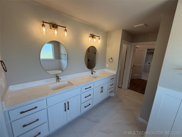 22832 E 106th Pl S, Broken Arrow, OK 74014 - full bathroom featuring double vanity, marble finish flooring, and a closet
