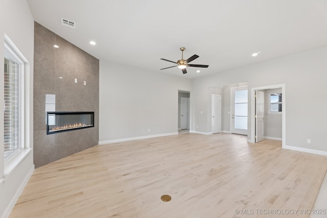 22832 E 106th Pl S, Broken Arrow, OK 74014 - unfurnished living room with ceiling fan, light wood-style flooring, recessed lighting, and a fireplace