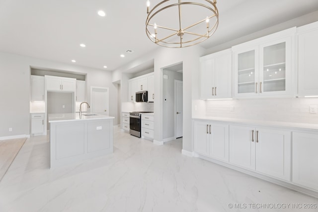 22832 E 106th Pl S, Broken Arrow, OK 74014 - kitchen with stainless steel appliances, a chandelier, decorative backsplash, white cabinetry, and glass insert cabinets