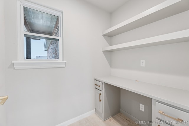 22832 E 106th Pl S, Broken Arrow, OK 74014 - unfurnished office featuring built in desk and light wood finished floors