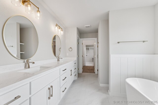 22832 E 106th Pl S, Broken Arrow, OK 74014 - full bath featuring marble finish floors, double vanity, a soaking tub, and a walk in closet