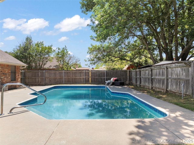 2003 8th NW, Ardmore, OK 73401 - view of pool with a fenced backyard and a patio