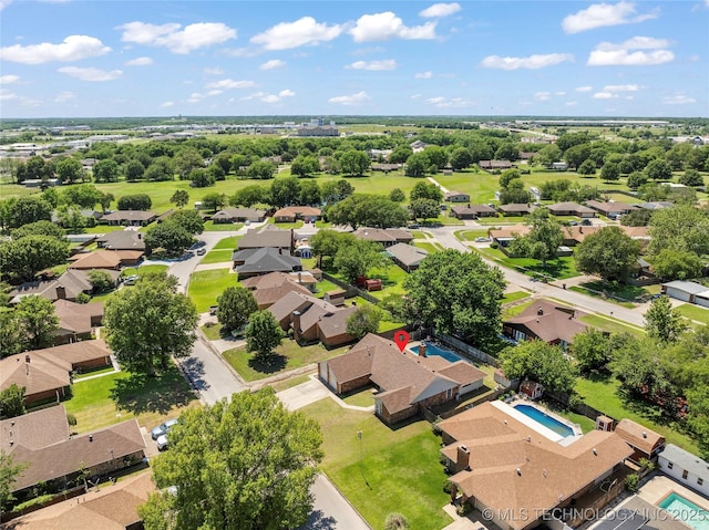 2003 8th NW, Ardmore, OK 73401 - aerial perspective of suburban area with a pool