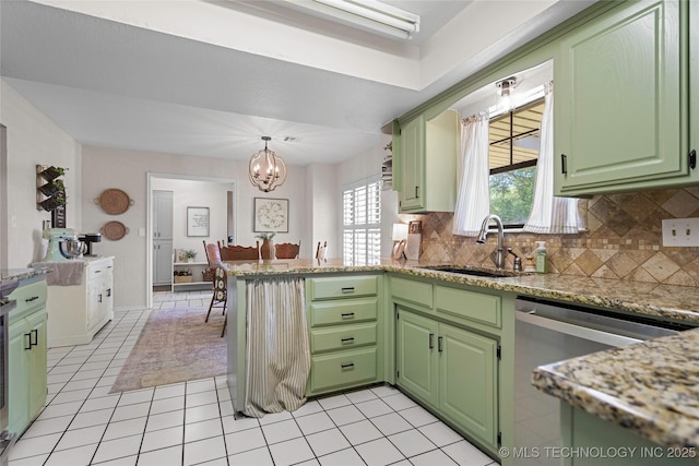 2003 8th NW, Ardmore, OK 73401 - kitchen with green cabinets, a peninsula, backsplash, and dishwasher