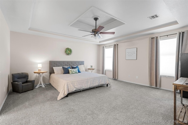 2003 8th NW, Ardmore, OK 73401 - bedroom with a tray ceiling, carpet, a ceiling fan, and baseboards