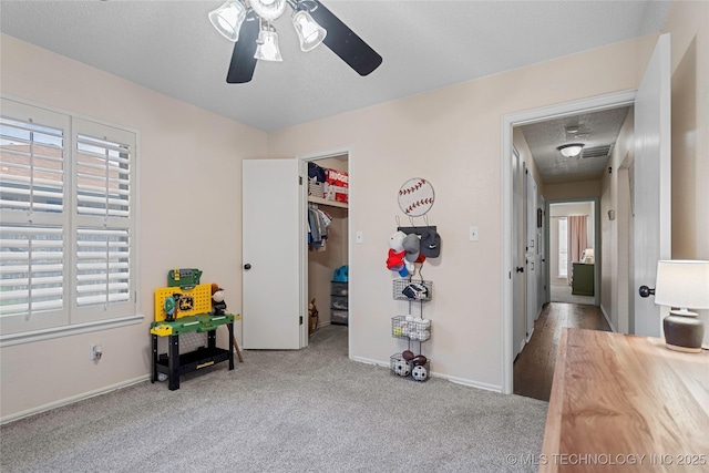 2003 8th NW, Ardmore, OK 73401 - bedroom featuring carpet flooring, a walk in closet, baseboards, and a closet