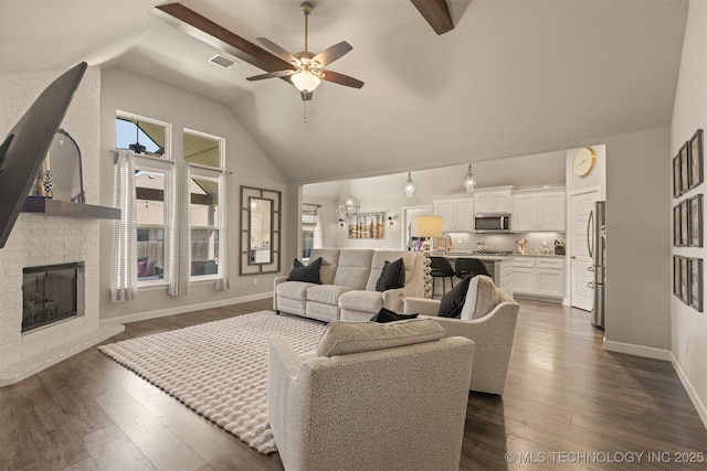 23107 E 104th Pl S, Broken Arrow, OK 74014 - living room featuring dark wood finished floors, a ceiling fan, a fireplace, baseboards, and high vaulted ceiling