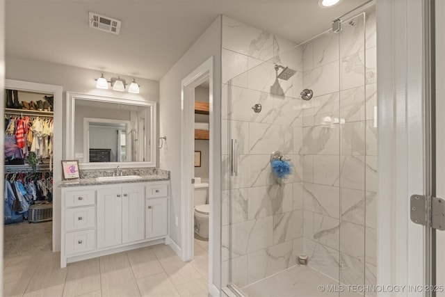 23107 E 104th Pl S, Broken Arrow, OK 74014 - bathroom with a stall shower, toilet, vanity, and a spacious closet