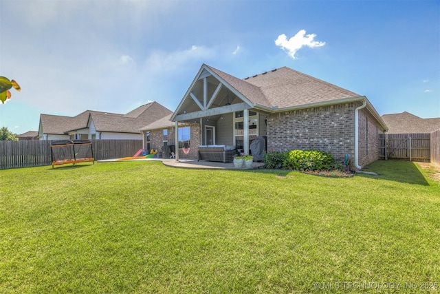 23107 E 104th Pl S, Broken Arrow, OK 74014 - rear view of property featuring a patio, brick siding, outdoor lounge area, and a shingled roof